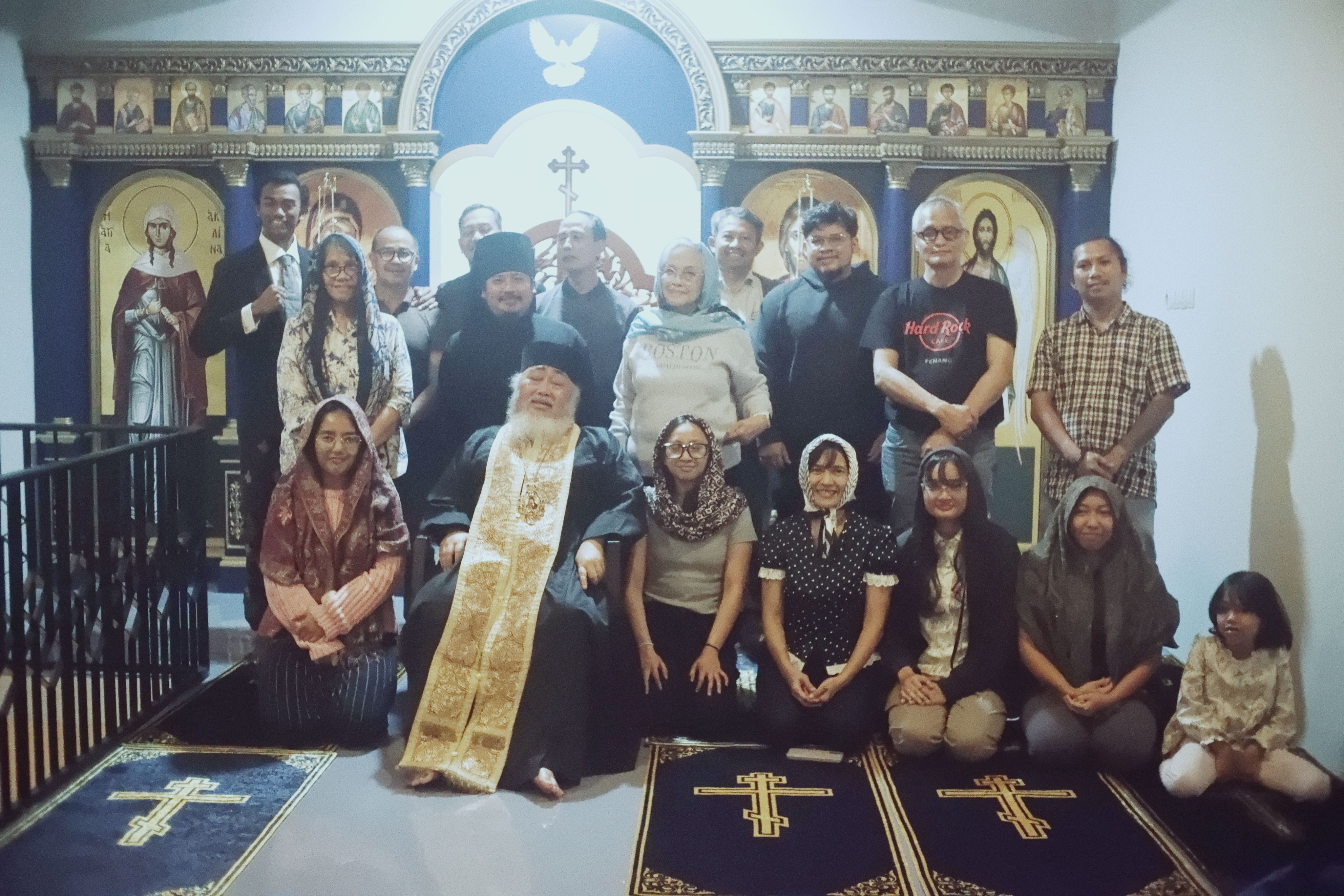 His Eminence Bishop Daniel Bambang Byantoro taking pictures together with the laities.