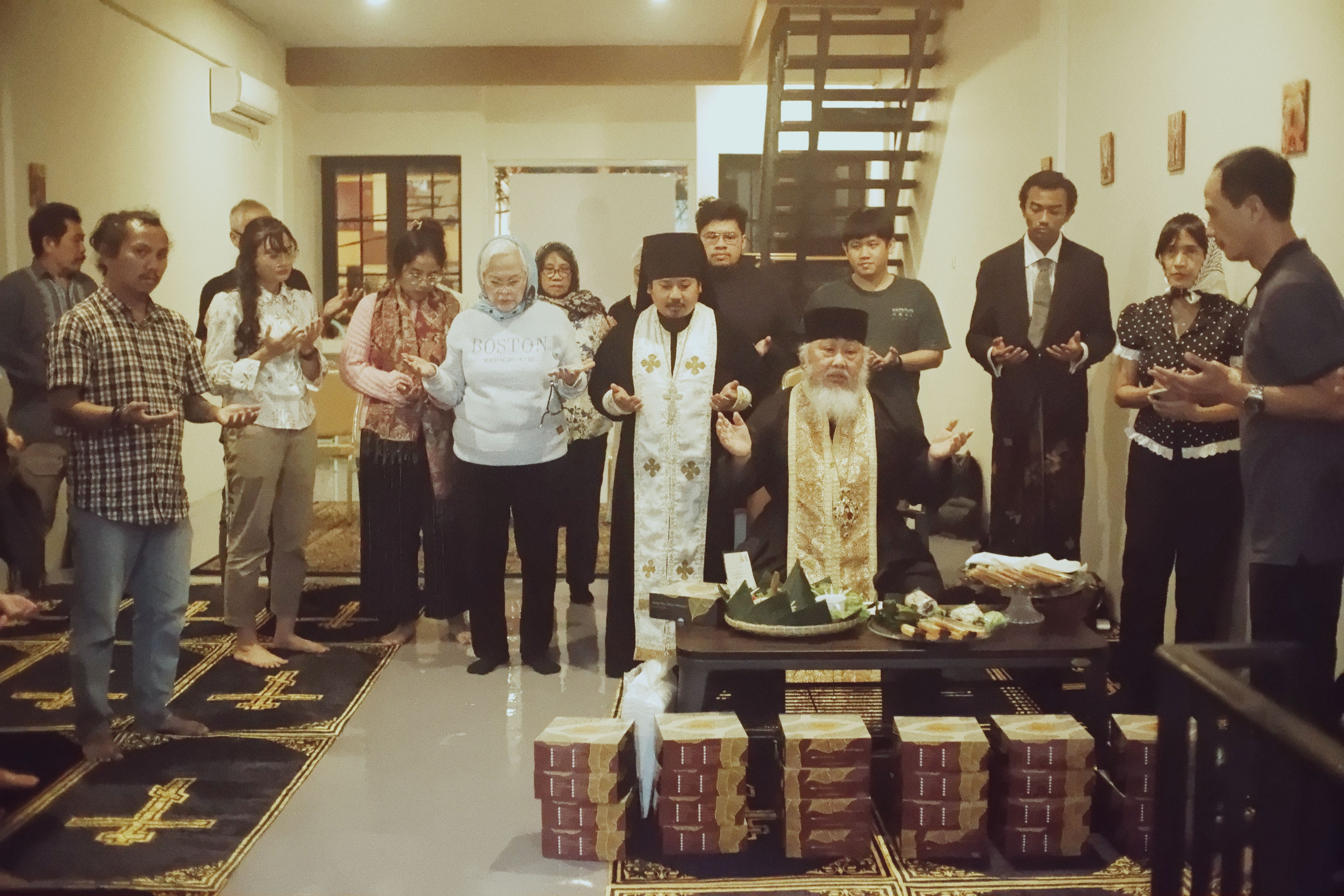 Presbyter Monk Demetrios with His Eminence Bishop Daniel Byantoro praying together.