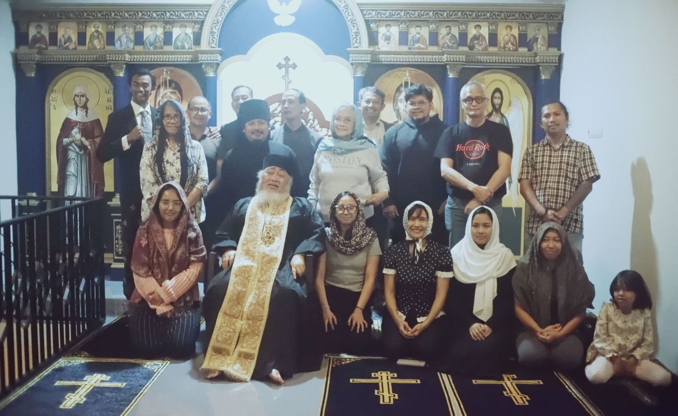 His Eminence Bishop Daniel Bambang Byantoro taking pictures together with the laities.